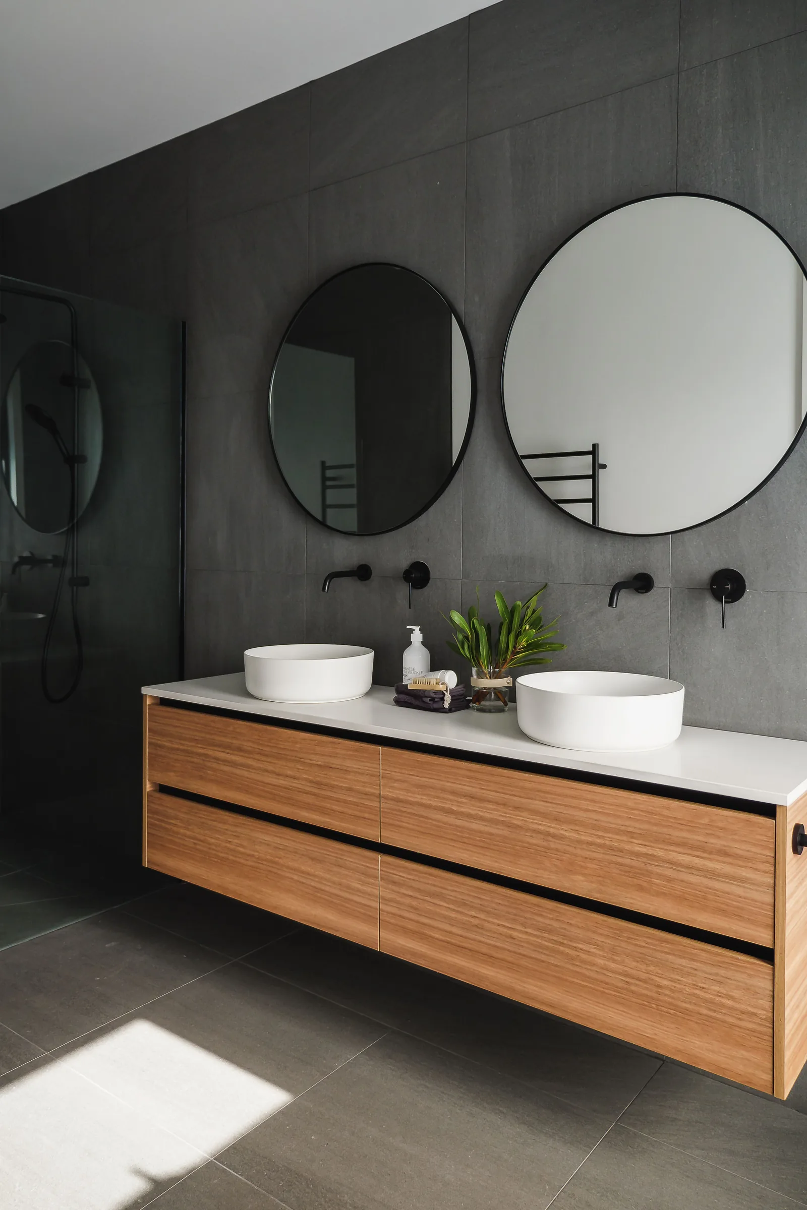 Knoll Street vanity with black-framed round mirror and black tapware
