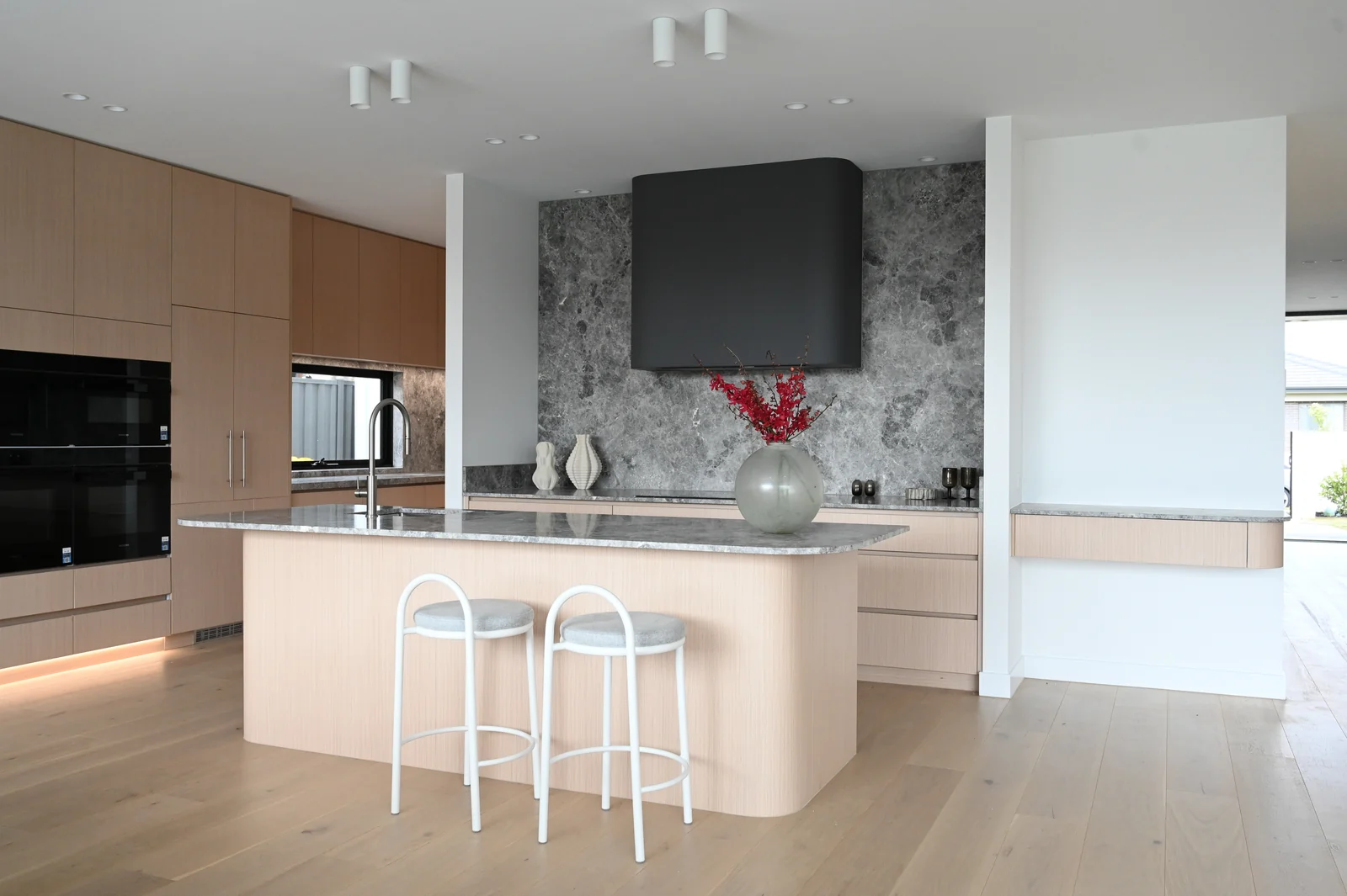 Finished kitchen at Noga Avenue with light oak and grey marble