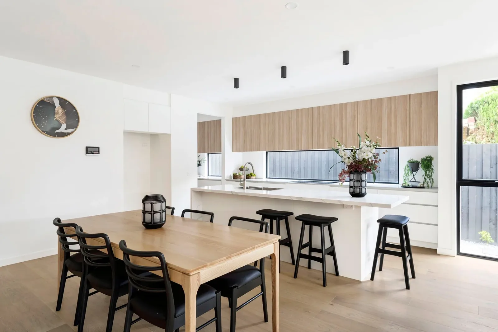 Dining area connected to the open-plan kitchen at Nyah Street